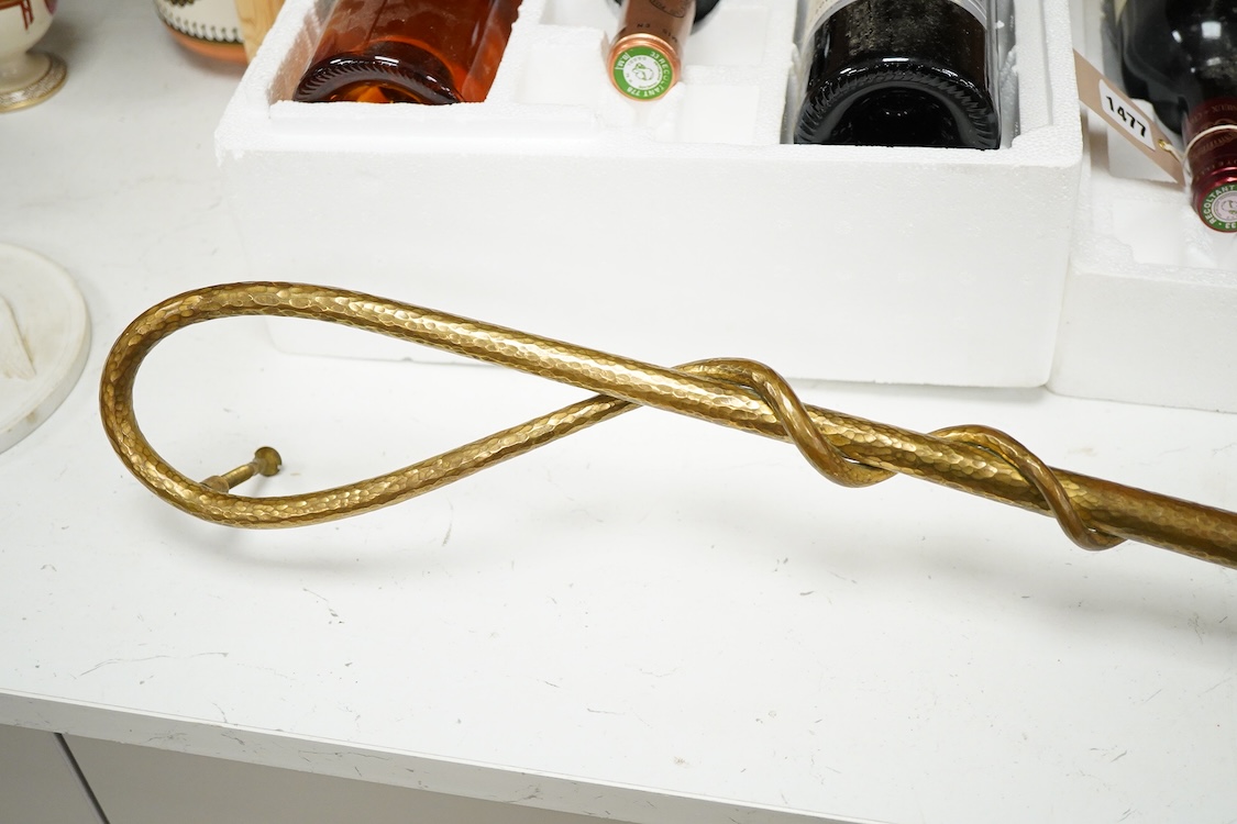An unusual early 20th century gilt bronze or brass ‘riding crop and hand’ door handle, 65cm